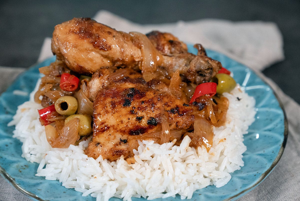 Yassa sauce with rice at 500 XOF or $0.86 USD